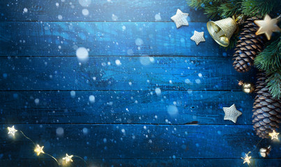 Christmas tree on blue wooden background