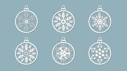Christmas balls set with a snowflake cut out of paper. Templates for laser cutting, plotter cutting or printing. Festive background.