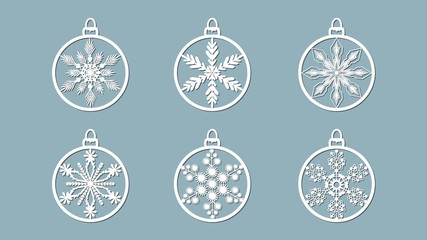 Christmas balls set with a snowflake cut out of paper. Templates for laser cutting, plotter cutting or printing. Festive background.