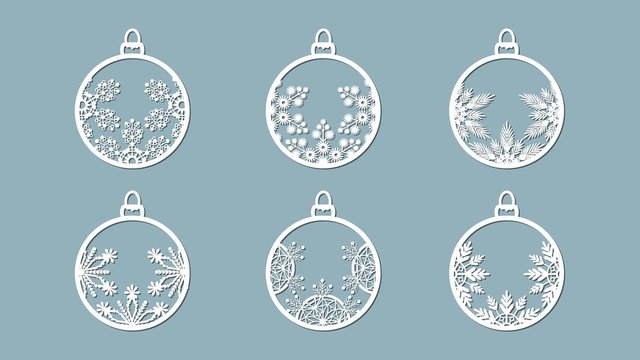 Christmas balls set with a snowflake cut out of paper. Templates for laser cutting, plotter cutting or printing. Festive background.