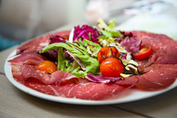 close up of tasty cold meats on the table