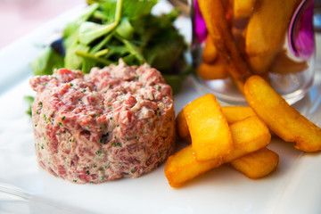 tasty Steak tartare (Raw beef) - classic steak tartare on white plate