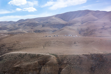 Several  Bedouin tents in the desert near the capital of Jordan - Amman