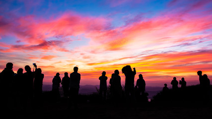 Silhouette of people with sunset.