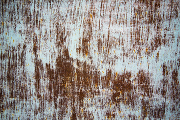 Grunge texture with a deep pattern. White brushstrokes over brown background