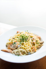 tasty pasta with salmon on a the table