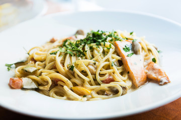 tasty pasta with salmon on a the table