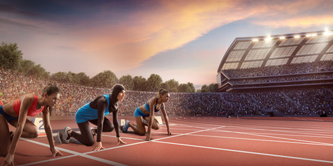Female athletes sprinting. Women in sport clothes on starting line prepares to run at the running track in professional stadium. Muslim athlete in sports hijab