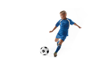 Young boy with soccer ball doing flying kick, isolated on white. football soccer players in motion on studio background. Fit jumping boy in action, jump, movement at game. - Powered by Adobe