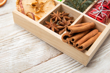 Christmas background with spices in a wooden box