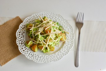 Tomato pea salad on the white plate with fork.