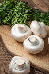 Fresh mushrooms on cutting board.