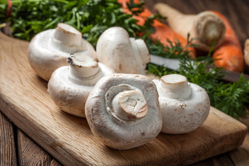 Fresh mushrooms on cutting board.