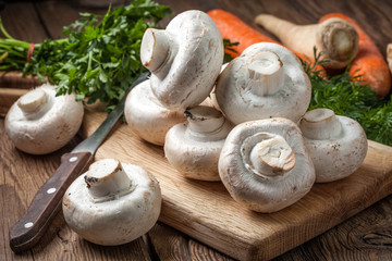 Fresh mushrooms on cutting board.