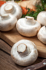 Fresh mushrooms on cutting board.