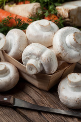 Fresh mushrooms on cutting board.