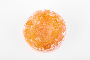 Colored round candy in powdered sugar. Bright candy.