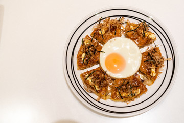 Japanese pizza with fried egg