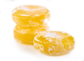 Colored round candy in powdered sugar. Bright candy.