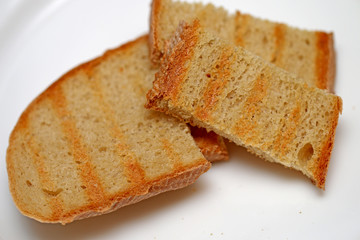 Bread of fried croutons on a white background