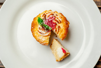 cake in a plate on a wooden background