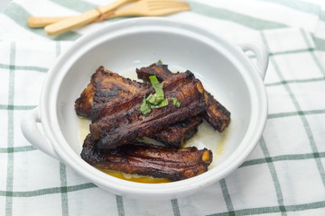 Pieces of fried pork rib on white dish