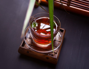 Cup of tea in oriental style on a wooden table