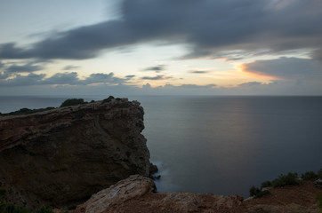 Fototapeta na wymiar Sunrise in cap martinet in long exposure, Ibiza