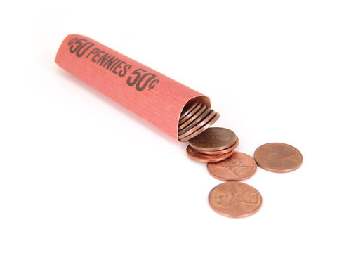 Roll of pennies over white background
