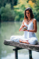 Young woman with Tibetan Singing Bowl