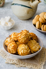 Different types of cookies on delicate background
