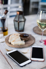 Top view image of two smartphone on a wooden table, space for text, ready for mockup. Empty space.
