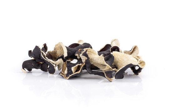 Lot of slices of dry black mushroom jew ear variety isolated on white background