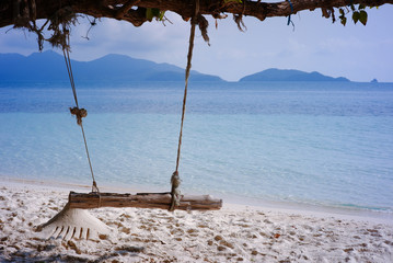 Swings at tree on the sand beautiful tropical beach at koh wai island, Trat, Thailand.