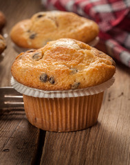 Tasty muffins on wooden boards