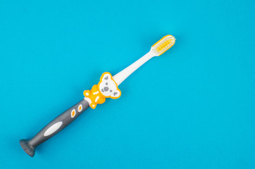 Toothbrushes on blue background. Copy space for text