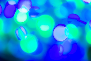 Blue and green festive christmas elegant abstract background with bokeh lights and stars