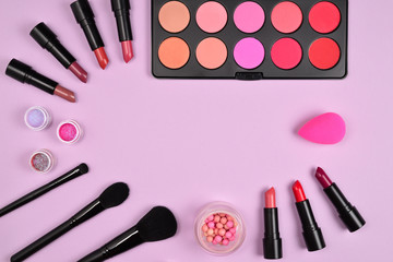 Professional makeup products with cosmetic beauty products, blushes, eye liner, eye lashes, brushes and tools.