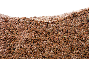 Layer of flax seeds in section isolated on white background. Agriculture poster concept