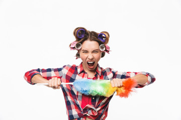 Angry housewife with curlers in hair standing