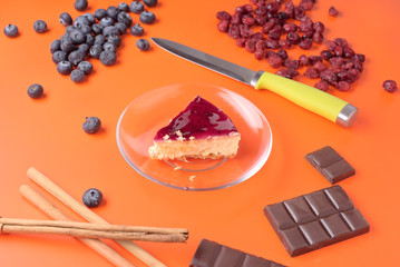 portion of cheese cake with other ingredients isolated on strong colorful background