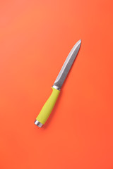 modern style kitchen knife on strong colorful background