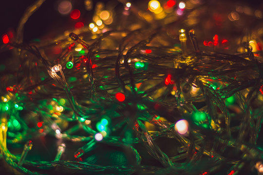 Christmas background with warm lights and copy space. Background with christmas lights. Christmas garland. New Year.