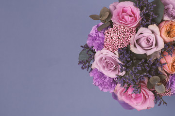 Closeup beautiful flowers in pastel colors on a blue background. Greeting card, Mom's day, wedding invitation, birthday .Copy space.