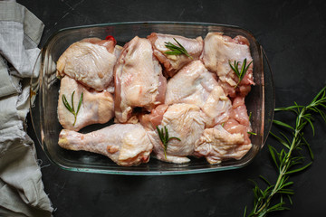 chicken crude pieces - raw meat (dark background). top view. to copy space © Alesia Berlezova
