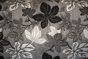 white black gray leaves on fabric background