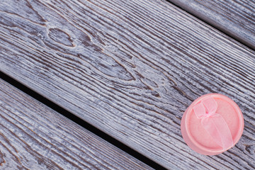 Jewelry gift box on wooden background. Fashion jewelry gift box and copy space. Stylish box for bracelets and earrings.