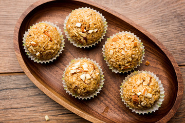 Oats laddu or Ladoo also known as Protein Energy balls. served in a plate or bowl. selective focus