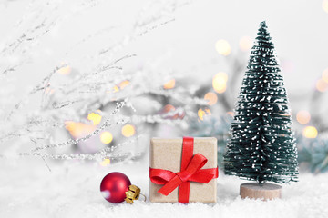 Christmas gift with red ribbon and Christmas decoration