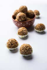 Oats laddu or Ladoo also known as Protein Energy balls. served in a plate or bowl. selective focus